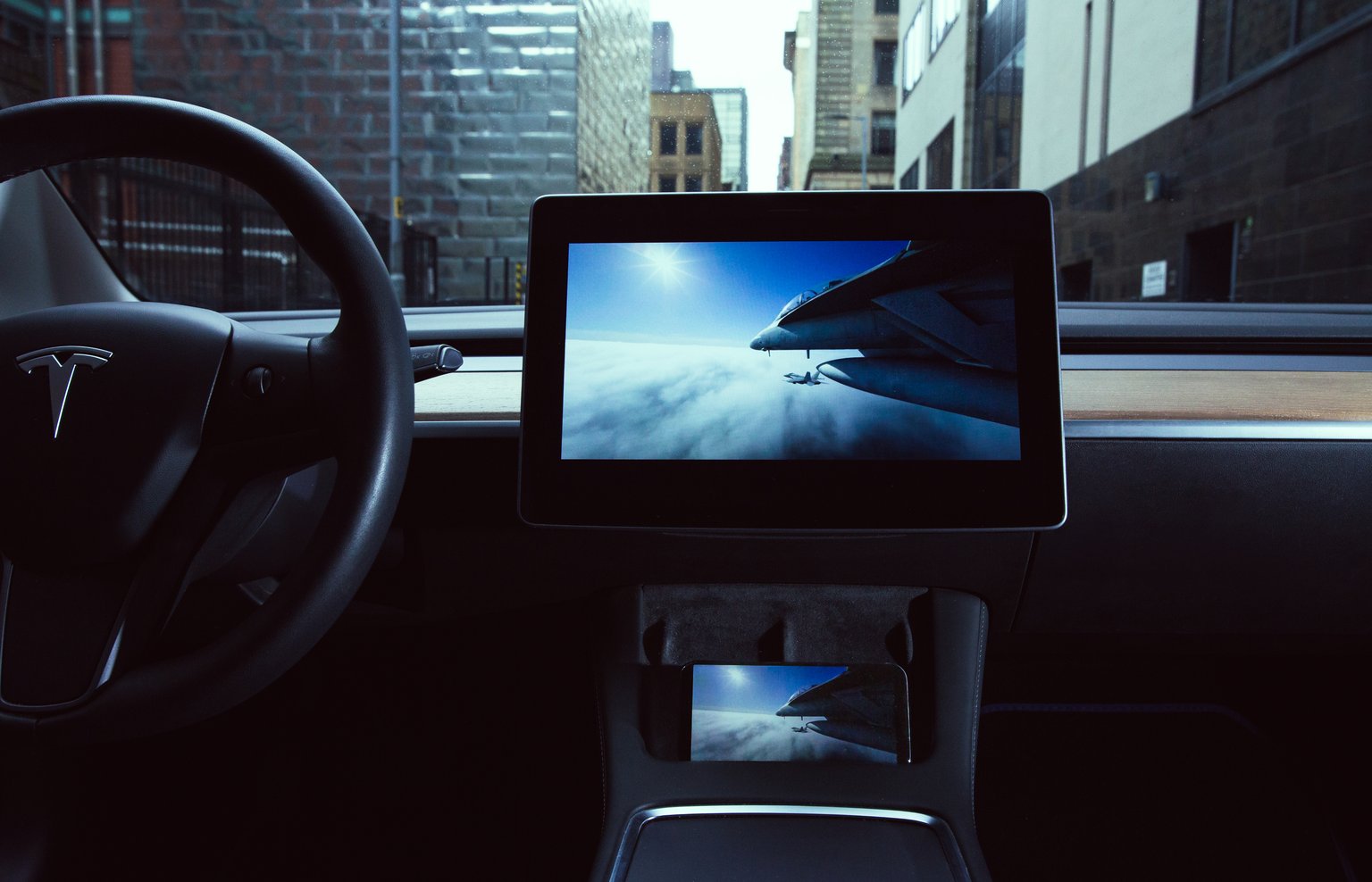 A film playing on a Tesla dashboard screen using Car Cast