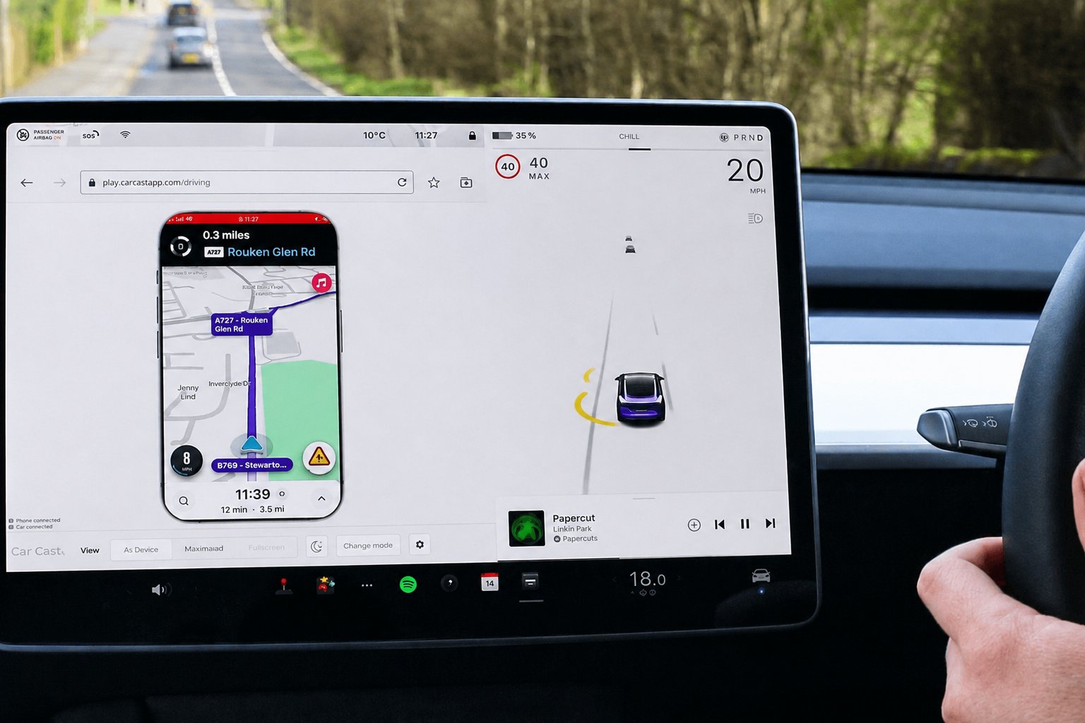 Waze navigation mirrored from a phone onto a Tesla screen while driving